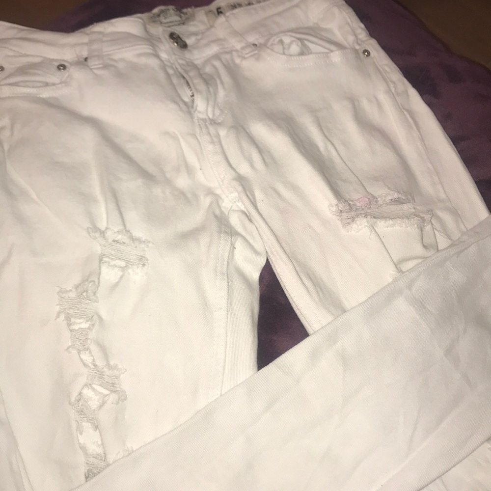 Super distressed white jeans